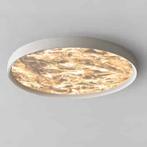 Modern white round flush mount ceiling light with a luminous marble effect diffuser and soft warm glow