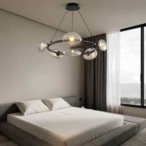 Modern black ring chandelier with clear textured glass shades in a contemporary bedroom
