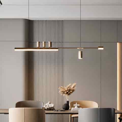 Black and gold linear LED kitchen island pendant with integrated light bar and cylindrical accent lights above a dining table