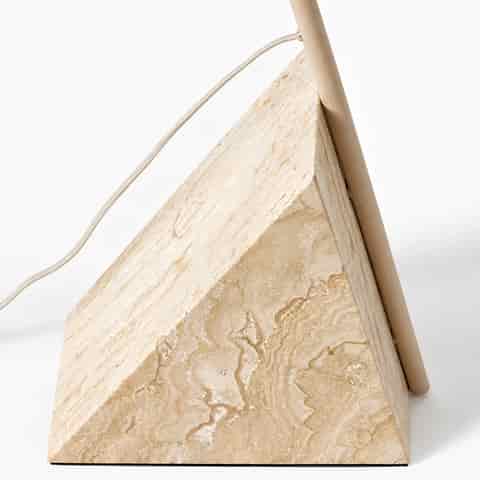 Close up of the ivory beige iron frame and natural beige marble base of a contemporary sculptural cantilever floor lamp