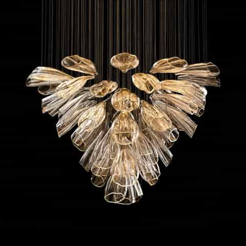 Large clear petal chandelier with layered floral design, fine suspension wires and warm ambient