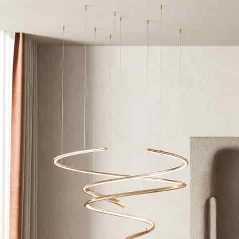 Electroplated gold stainless steel spiral LED chandelier with layered flowing curves, warm integrated light and slim cable suspension