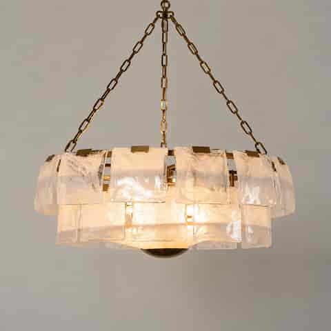 Gold metal and textured glass chandelier for hotels, restaurants, homes, and retail projects. Layered panels add depth, with bulk sourcing for coordinated supply and repeat orders.