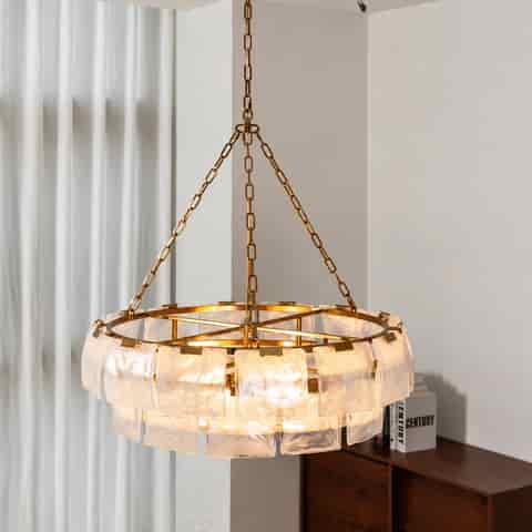Gold chain hung glass chandelier showing its open metal frame and layered translucent glass panels